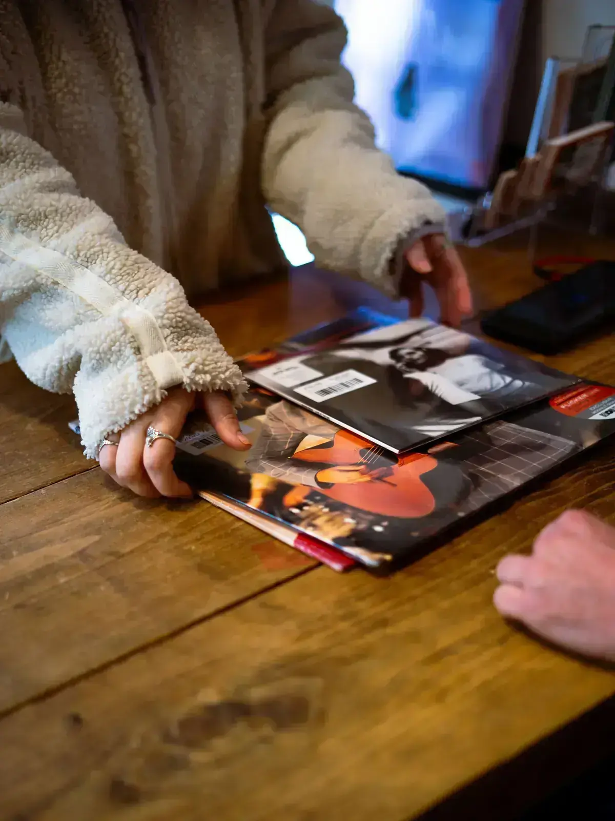 Customer browsing vinyl records in an independent record shop